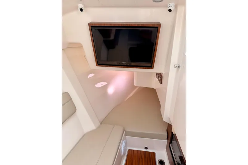 Slide: The Image of Interior of 2018 Pursuit DC 365 Dual Console with TV and seating area. - 38