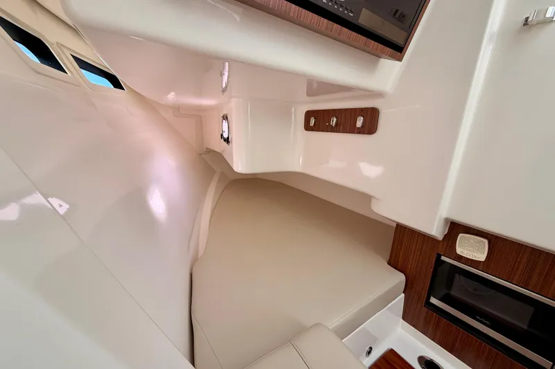 Slide: The Image of 2018 Pursuit DC 365 Dual Console cabin interior with seating and modern amenities. - 40