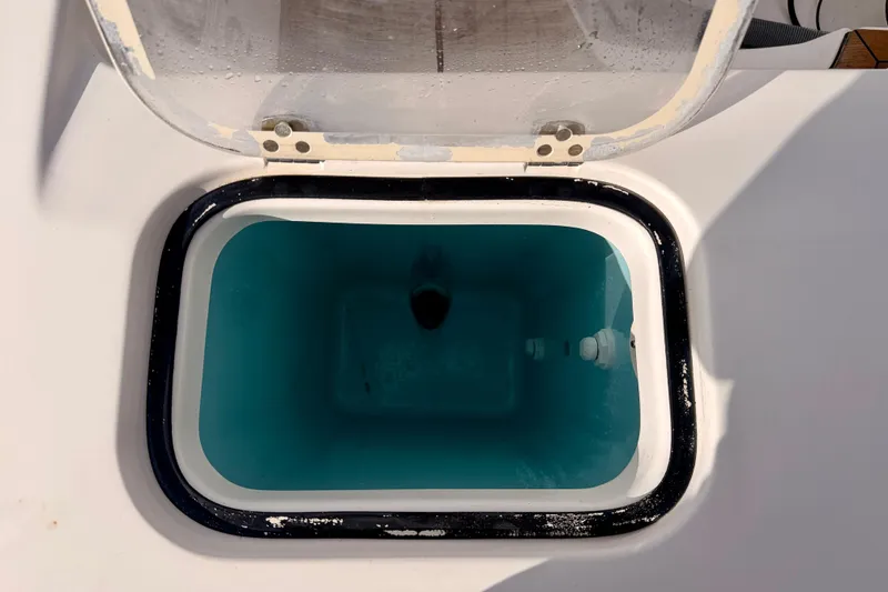 Slide: The Image of Open livewell on 2018 Pursuit DC 365 Dual Console boat, filled with water. - 58