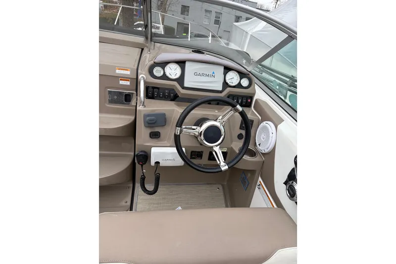 Slide: The Image of 2016 Regal 2660 Express Cruiser dashboard with Garmin navigation system and steering wheel. - 9