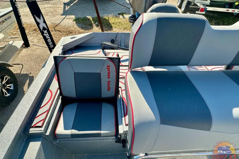 Slide: The Image of 2024 Express SW20B BAY boat interior with gray and red seating, featuring "Xpress Boats" branding. - 11