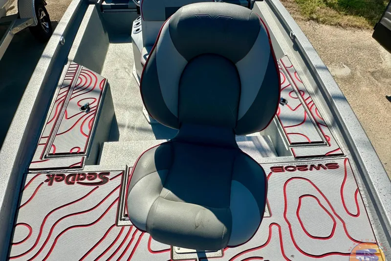 Slide: The Image of 2024 Express SW20B BAY boat interior with custom SeaDek flooring and comfortable seating. - 16