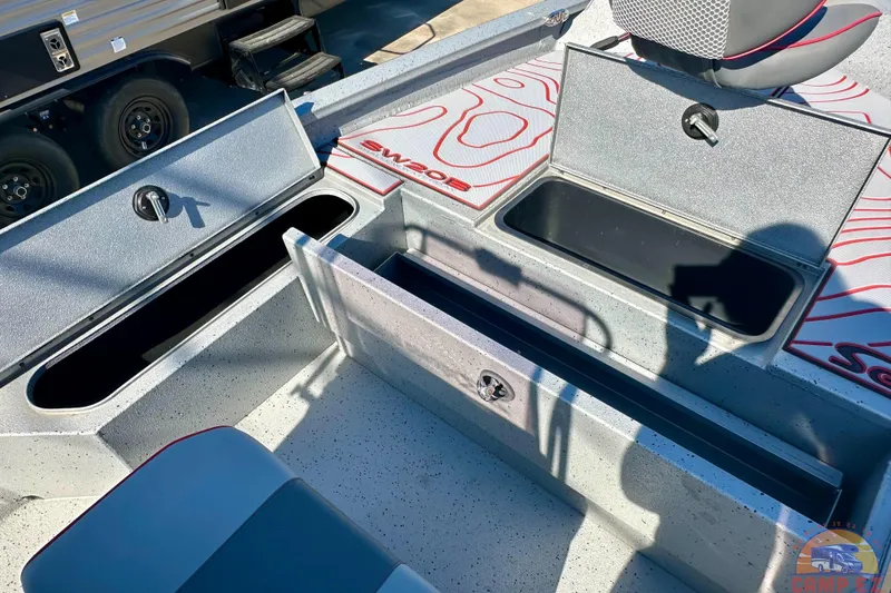 Slide: The Image of 2024 Express SW20B BAY boat interior with open storage compartments and seating. - 17