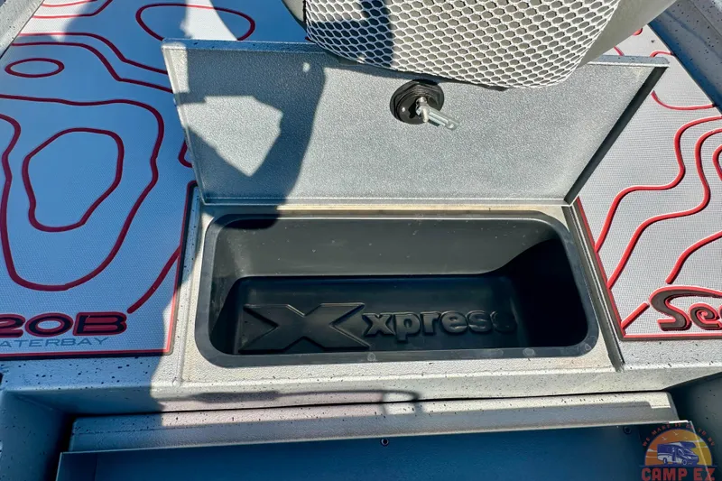Slide: The Image of 2024 Express SW20B BAY boat storage compartment with logo and textured flooring. - 19