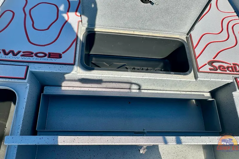 Slide: The Image of 2024 Express SW20B BAY boat interior with storage compartments and textured design. - 20