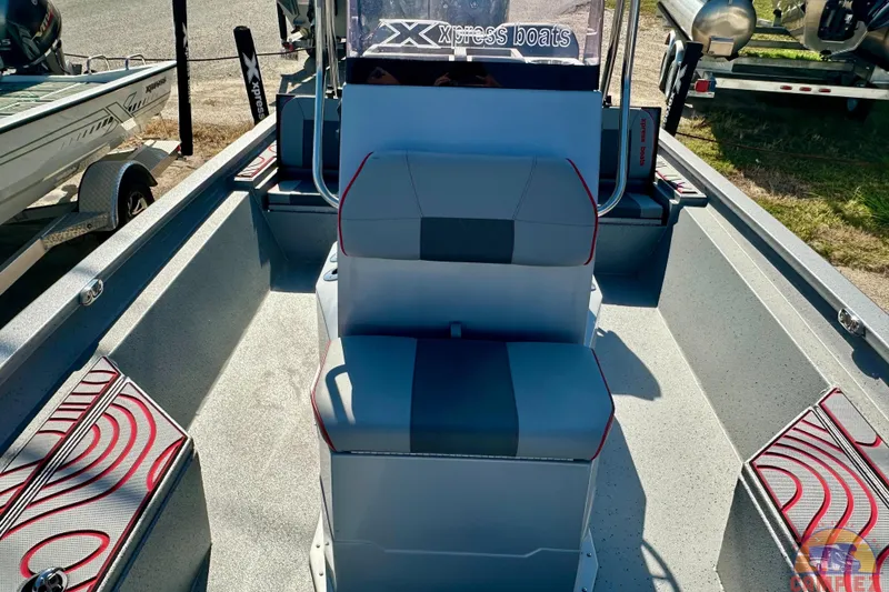 Slide: The Image of 2024 Express SW20B BAY boat interior with gray seating and red accents. - 23