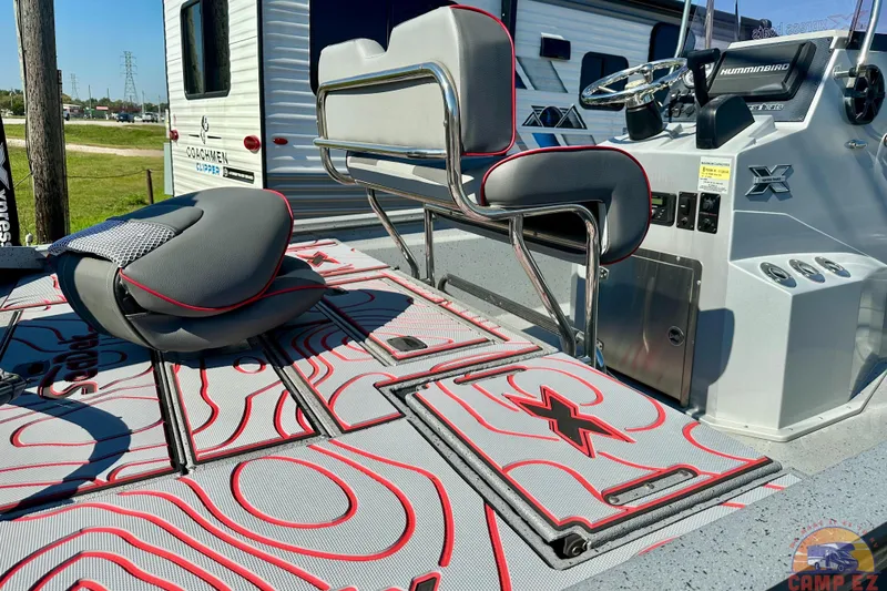 Slide: The Image of 2024 Express SW20B BAY boat interior with stylish seating and modern dashboard controls. - 26