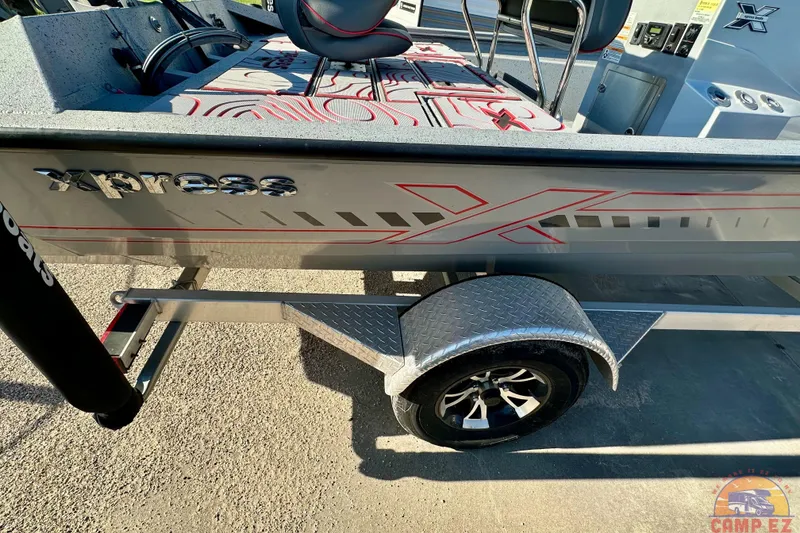 Slide: The Image of 2024 Express SW20B BAY boat on trailer, featuring sleek design and modern graphics. - 27