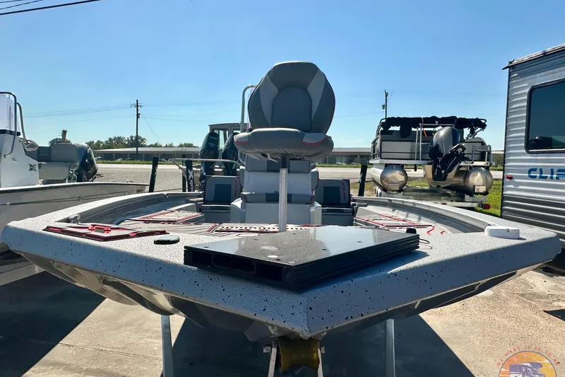 Slide: The Image of 2024 Express SW20B BAY boat with seating and equipment, displayed outdoors. - 3