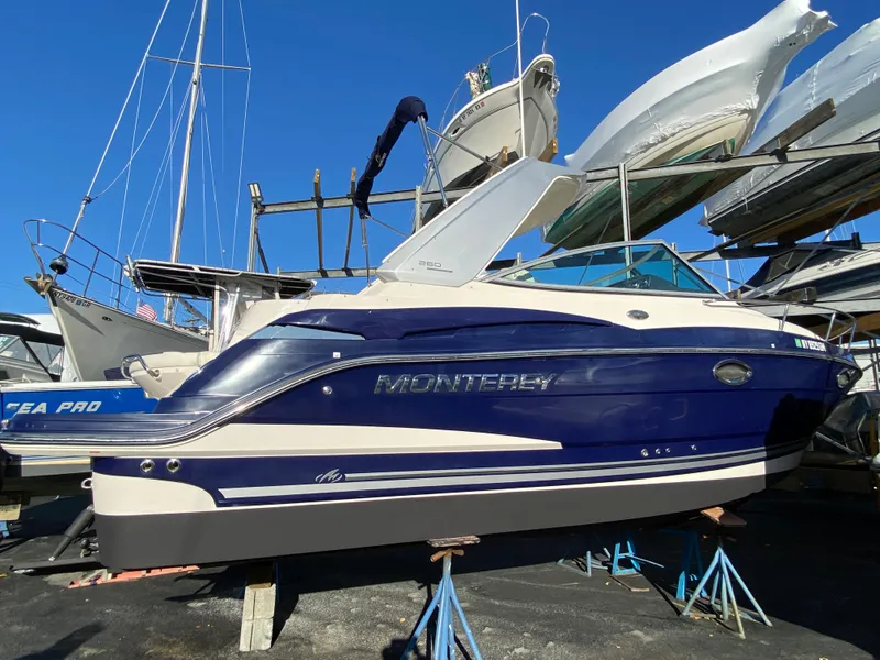 The Image of 2014 Monterey 260 SCR boat on stands outdoors. - 0