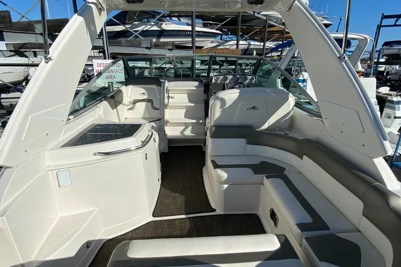 Slide: The Image of Interior of a 2014 Monterey 260 SCR boat, white upholstery. - 14