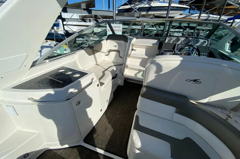 Slide: The Image of 2014 Monterey 260 SCR boat interior with seating and dashboard. - 16