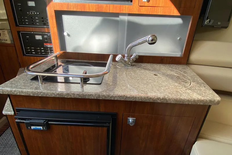 Slide: The Image of Galley in a 2014 Monterey 260 SCR boat. - 18