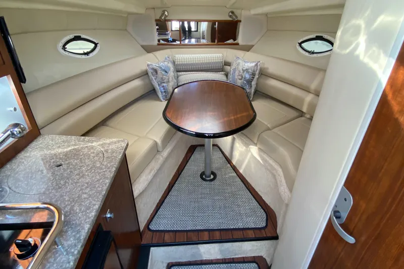 Slide: The Image of Interior of a 2014 Monterey 260 SCR boat with table and seating area. - 20