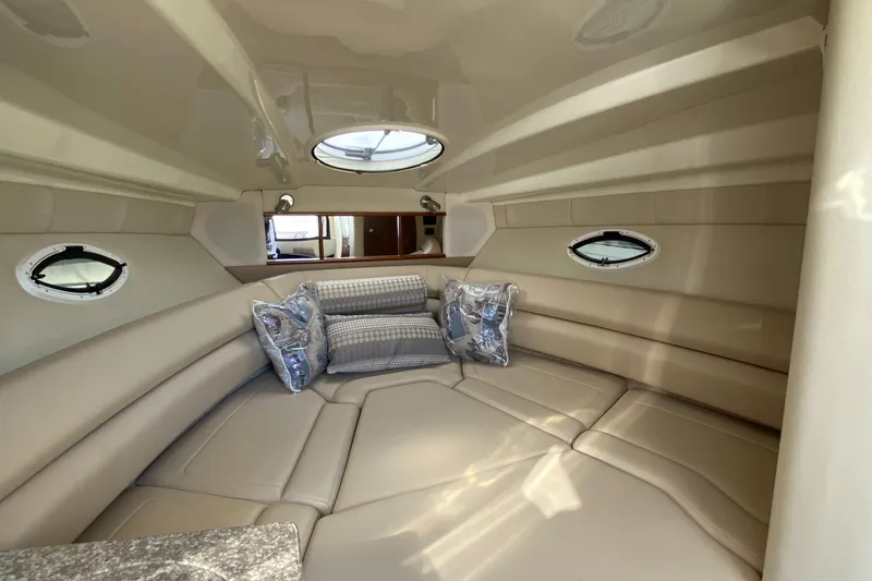 Slide: The Image of Interior of a 2014 Monterey 260 SCR yacht with beige upholstery. - 21