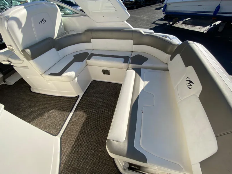 Slide: The Image of Interior of a 2014 Monterey 260 SCR boat with gray and white seating. - 3