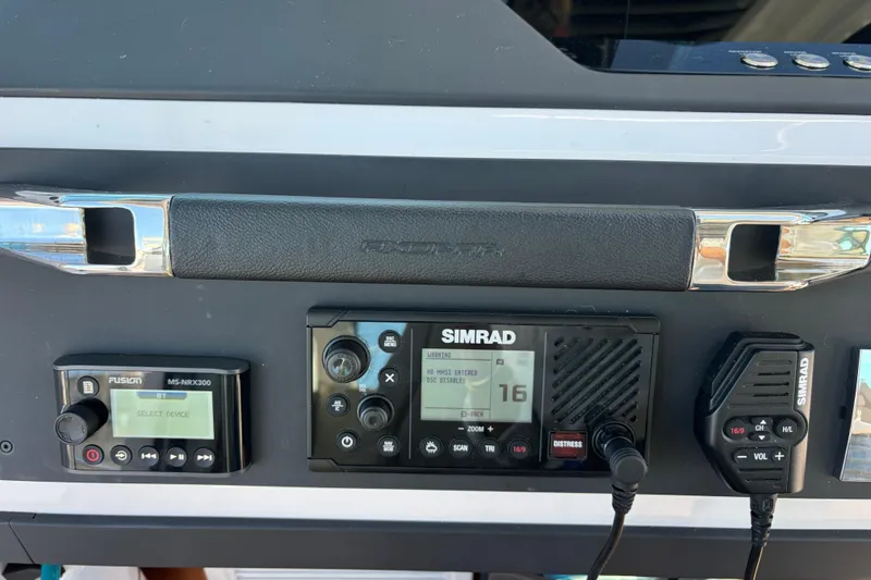 Slide: The Image of Control panel of 2022 Axopar 28 AFT CABIN with Simrad and Fusion devices. - 21