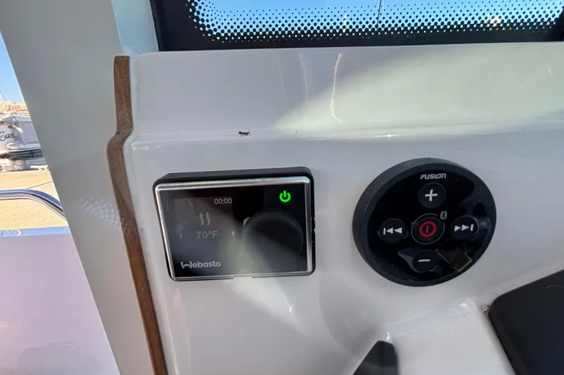 Slide: The Image of Control panel of 2022 Axopar 28 AFT CABIN with Webasto and Fusion systems. - 29