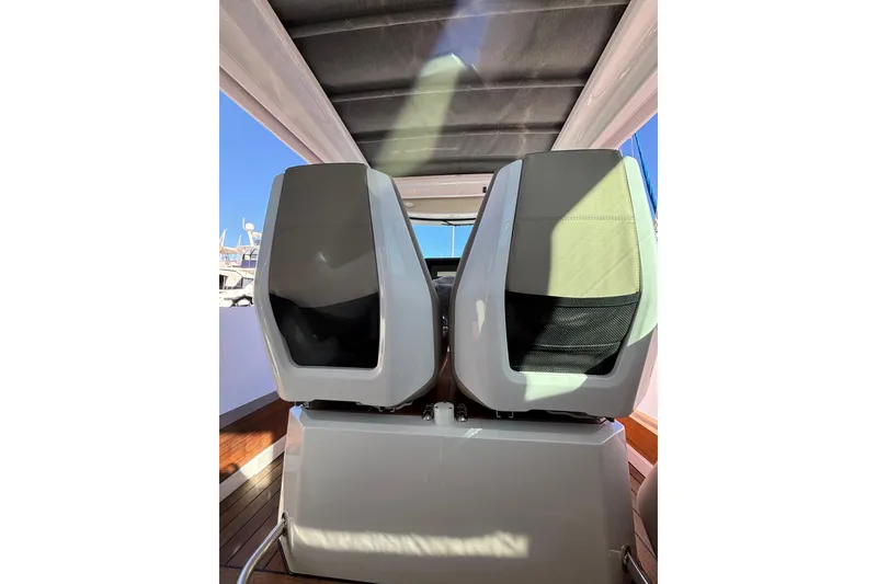 Slide: The Image of 2022 Axopar 28 AFT CABIN interior with modern seating and sleek design. - 32