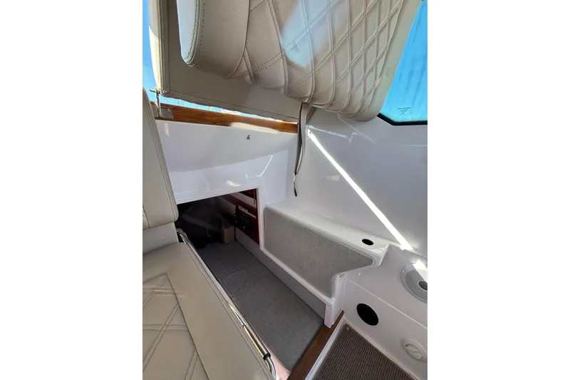 Slide: The Image of Interior of 2022 Axopar 28 AFT CABIN, featuring modern seating and sleek design elements. - 35