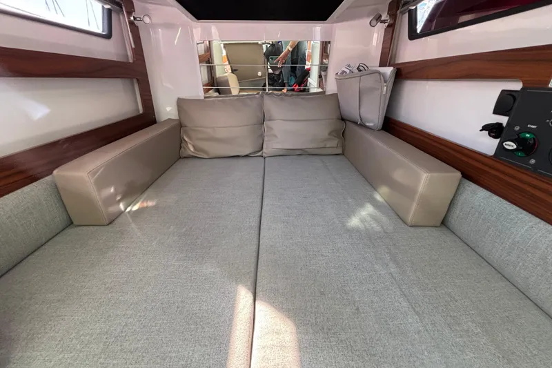 Slide: The Image of 2022 Axopar 28 AFT CABIN interior with comfortable seating and modern design. - 37