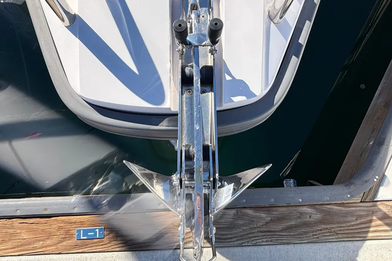 Slide: The Image of 2022 Axopar 28 AFT CABIN boat anchor detail at dock. - 4