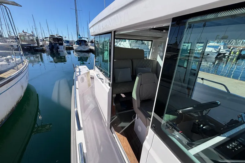 Slide: The Image of 2022 Axopar 28 AFT CABIN boat docked at marina, interior view. - 41
