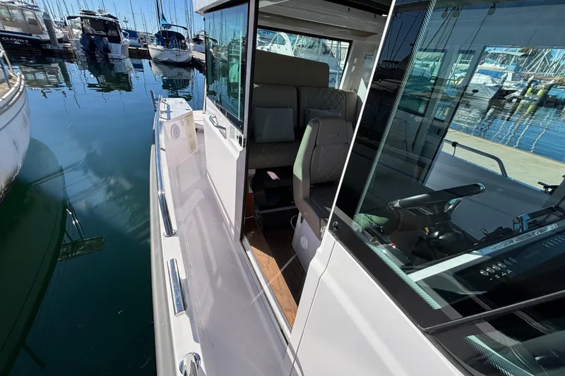 Slide: The Image of 2022 Axopar 28 AFT CABIN boat docked, showcasing sleek design and modern interior. - 42
