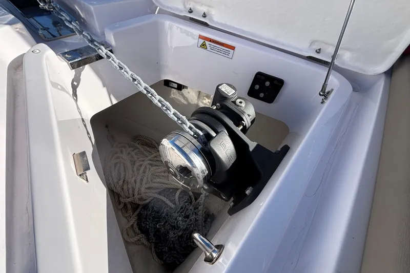 Slide: The Image of Anchor winch system on 2022 Axopar 28 AFT CABIN boat, featuring chain and rope storage. - 48