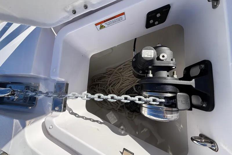 Slide: The Image of Anchor chain and winch system on 2022 Axopar 28 AFT CABIN boat. - 49
