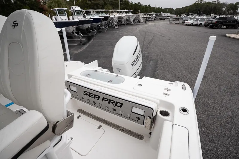 Slide: The Image of 2026 Sea Pro 222 Center Console boat with Suzuki engine in a marina. - 10