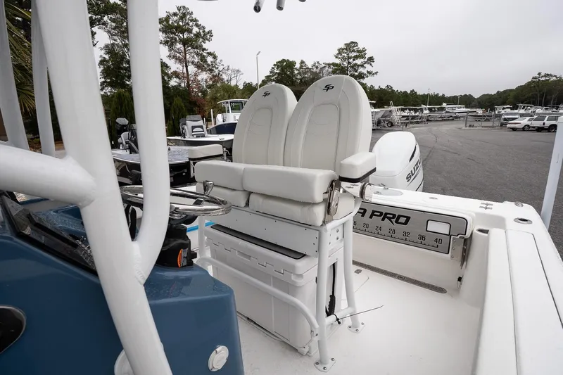 Slide: The Image of 2026 Sea Pro 222 Center Console boat interior with dual seats and steering wheel. - 11