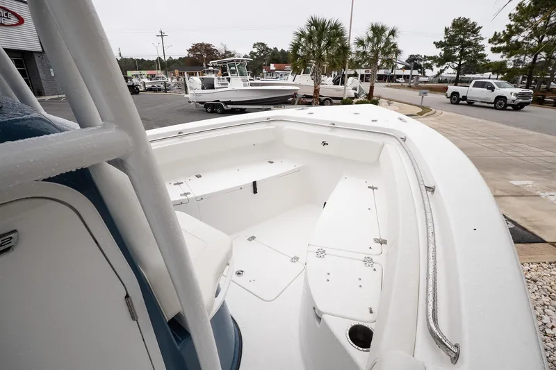 Slide: The Image of 2026 Sea Pro 222 Center Console boat displayed outdoors, showcasing spacious seating and sleek design. - 13