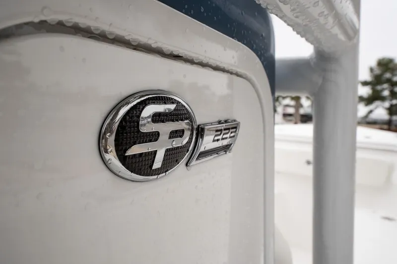 Slide: The Image of 2026 Sea Pro 222 Center Console boat emblem in close-up view. - 14