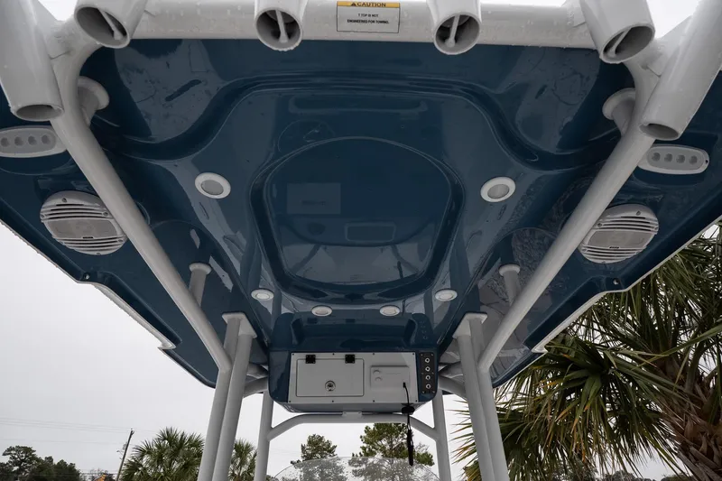 Slide: The Image of 2026 Sea Pro 222 Center Console boat's underside view with speakers and rod holders. - 15