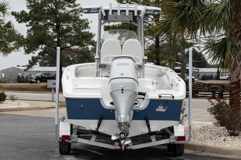 Slide: The Image of 2026 Sea Pro 222 Center Console boat on trailer, rear view, parked outdoors. - 6