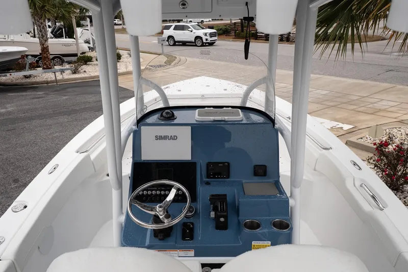 Slide: The Image of 2026 Sea Pro 222 Center Console boat interior with Simrad navigation system. - 9