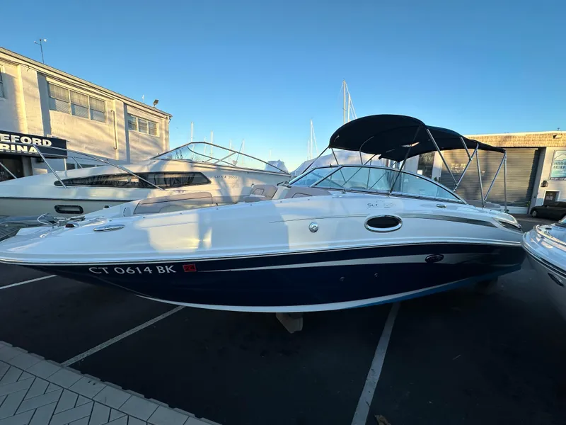 The Image of 2011 Sea Ray 260 Sundeck boat parked at marina. - 0