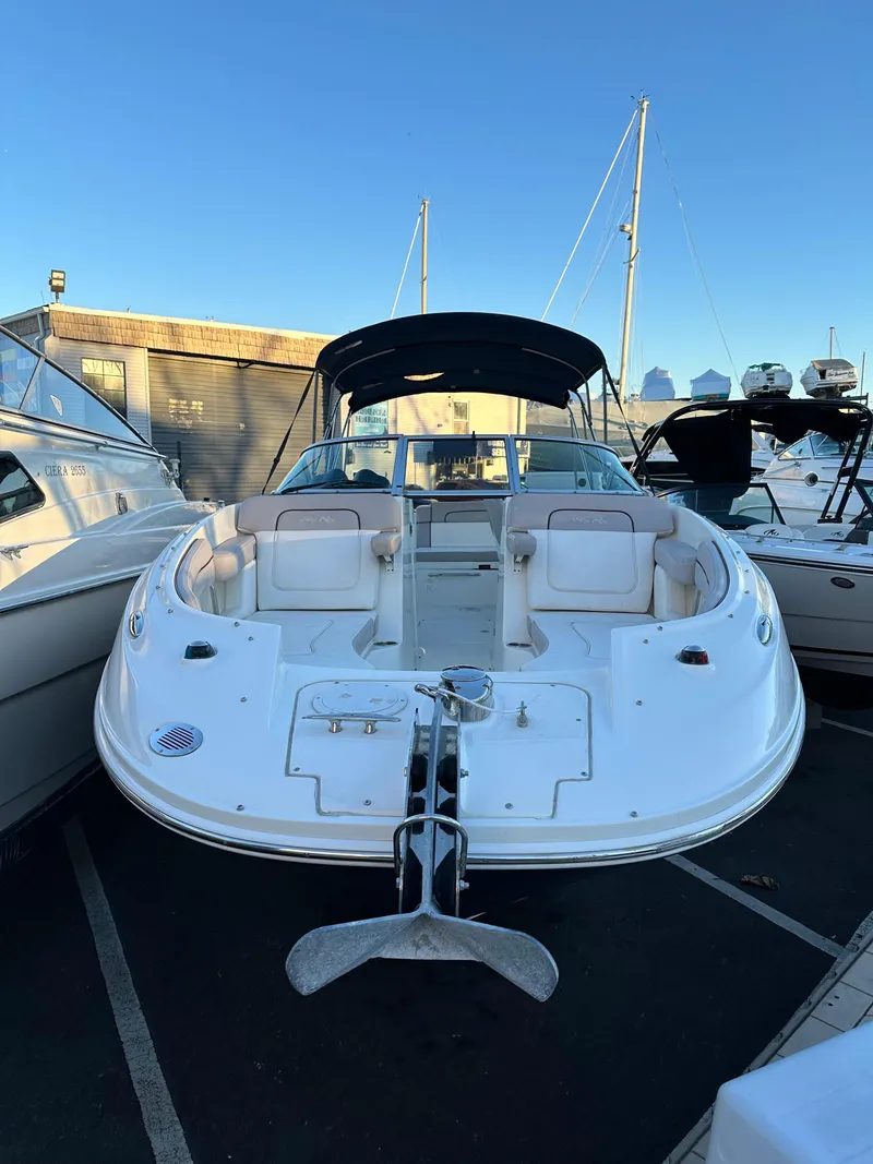 Slide: The Image of 2011 Sea Ray 260 Sundeck boat docked at marina. - 2