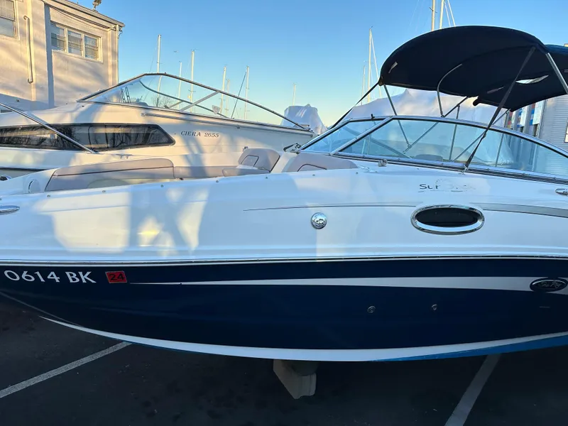 Slide: The Image of 2011 Sea Ray 260 Sundeck boat docked at marina. - 3