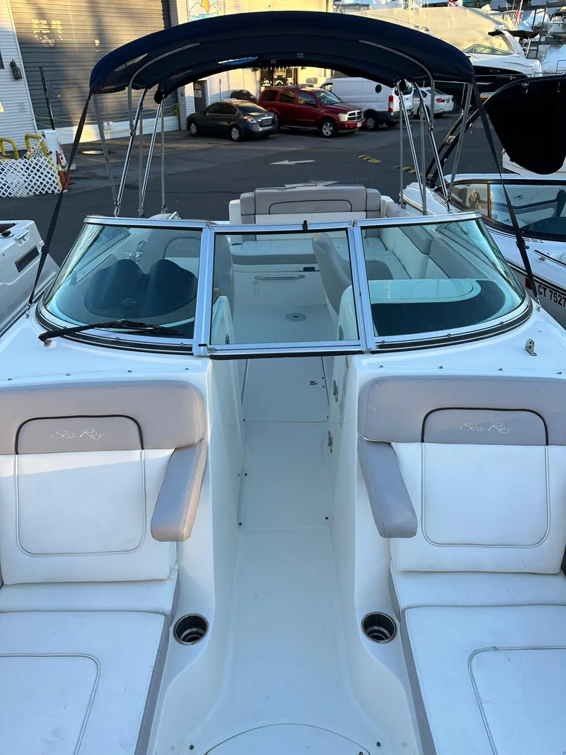 Slide: The Image of 2011 Sea Ray 260 Sundeck boat with canopy in marina. - 5