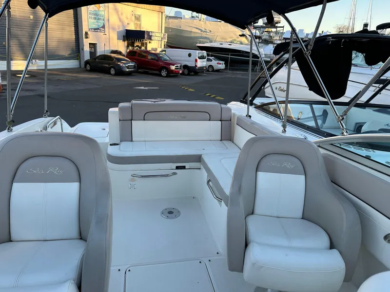 Slide: The Image of Interior of a 2011 Sea Ray 260 Sundeck boat at the marina. - 6