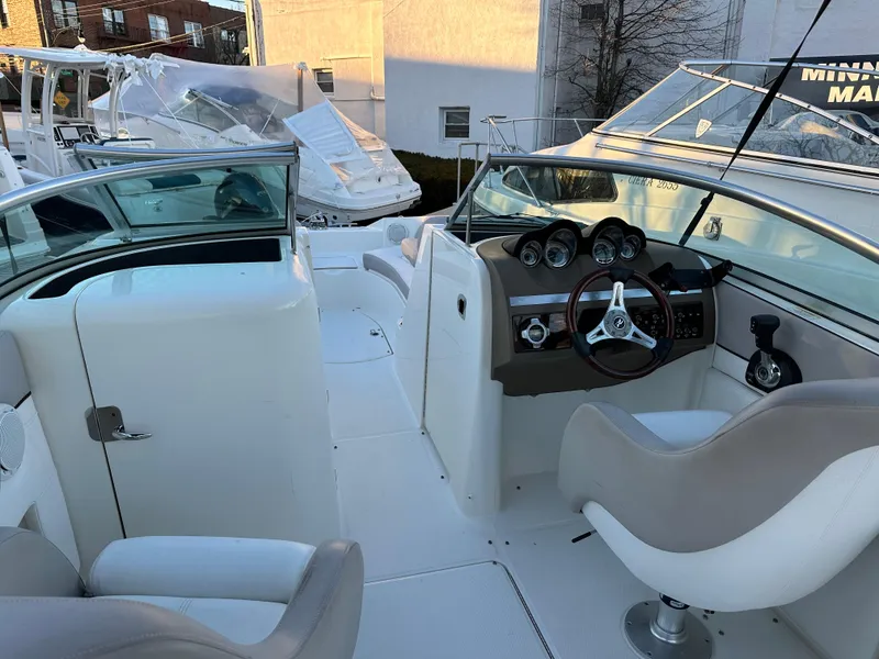 Slide: The Image of Interior of a 2011 Sea Ray 260 Sundeck boat with helm station. - 7