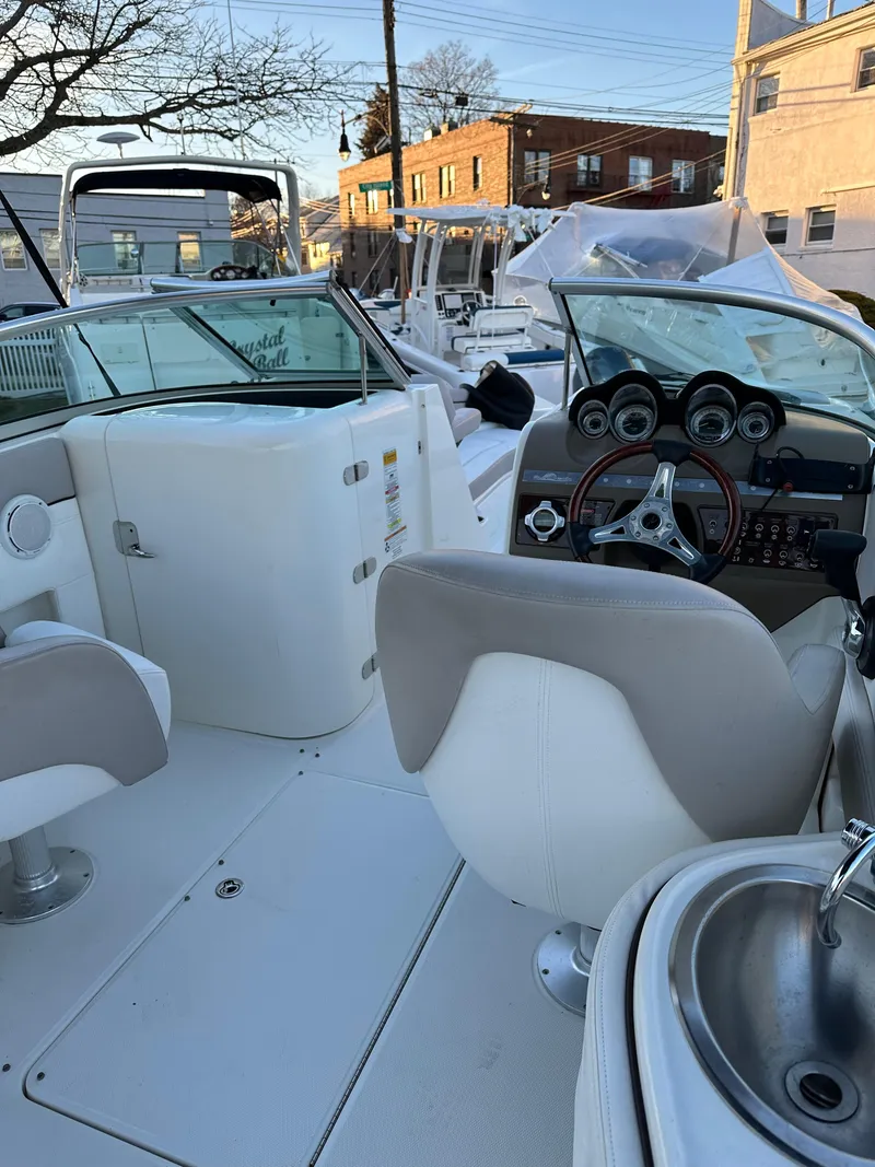 Slide: The Image of Interior of a 2011 Sea Ray 260 Sundeck boat with helm station. - 9