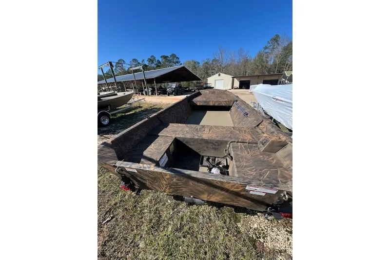 Slide: The Image of 2026 G3 Gator Tough 15 FL boat with camouflage design in outdoor setting. - 3