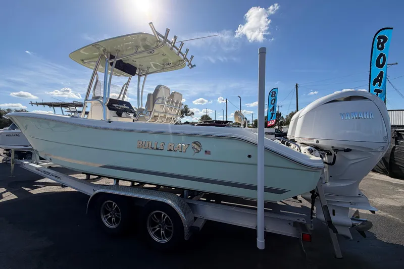 Slide: The Image of 2025 Bulls Bay 255 Center Console boat on trailer, featuring Yamaha engine. - 10