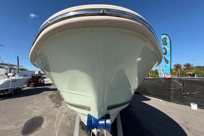 Slide: The Image of 2025 Bulls Bay 255 Center Console boat on trailer, viewed from the front. - 14