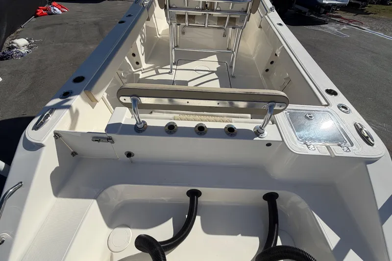 Slide: The Image of 2025 Bulls Bay 255 Center Console boat interior with seating and storage compartments. - 16
