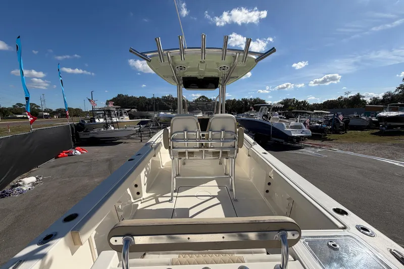 Slide: The Image of 2025 Bulls Bay 255 Center Console boat displayed outdoors under a clear blue sky. - 18