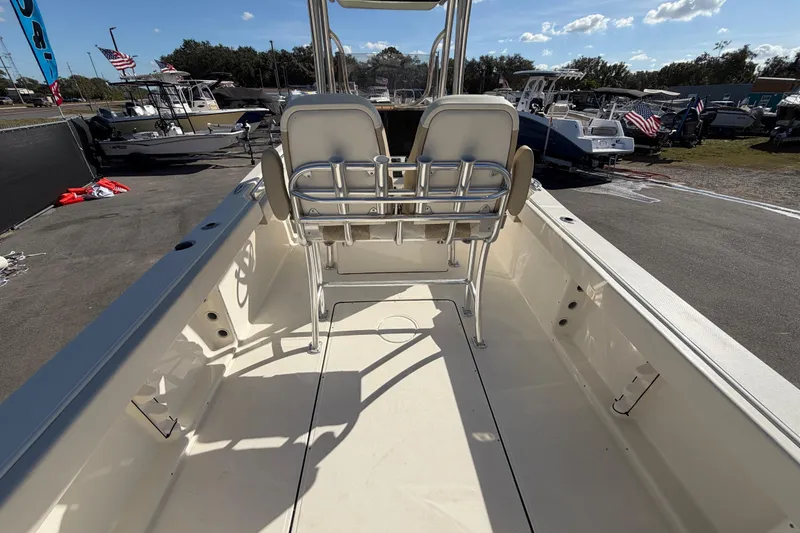 Slide: The Image of 2025 Bulls Bay 255 Center Console boat interior with seating and console view. - 20